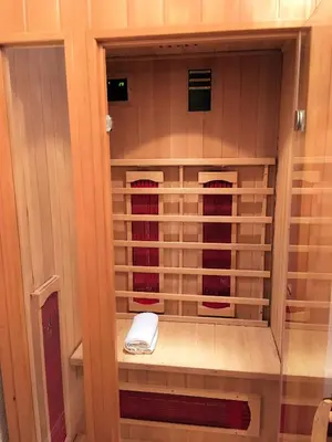 a wine rack with a white phone in it at Woodlands Holiday Apartments in Lytham St Annes