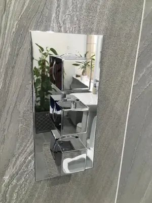 a reflection of a kitchen mixer in a mirror at Woodlands Holiday Apartments in Lytham St Annes