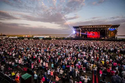 an aerial view of a large crowd of people at a concert at Woodlands Holiday Apartments in Lytham St Annes