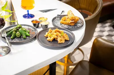 three plates of food sitting on a table at Hotel Indigo Liverpool by IHG in Liverpool