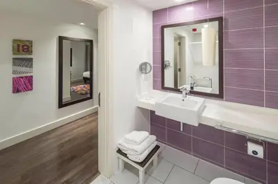 a bathroom with a sink and a mirror at Hotel Indigo Liverpool by IHG in Liverpool