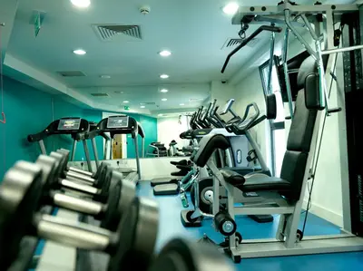 a gym with several tread machines in a room at Hotel Indigo Liverpool by IHG in Liverpool