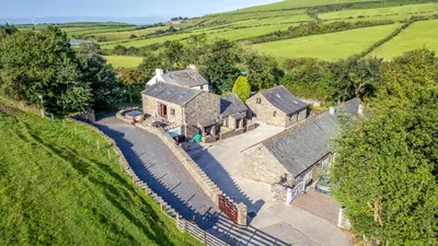 an aerial view of a house in a field at Woodside Barn in Ulverston