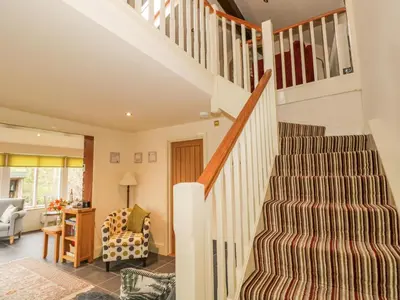 a staircase in a home with a living room at Beck Cottage in Ulverston