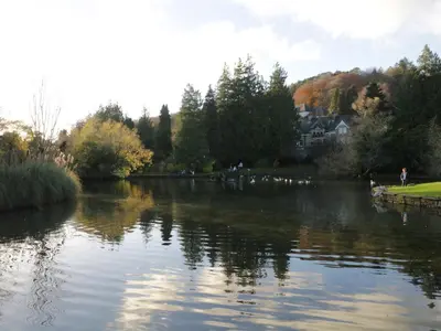 a view of a river with trees and houses at Mulberry Cottage in Grange Over Sands