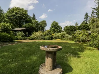 a bird bath sitting in the middle of a yard at Buttermere in Ulverston