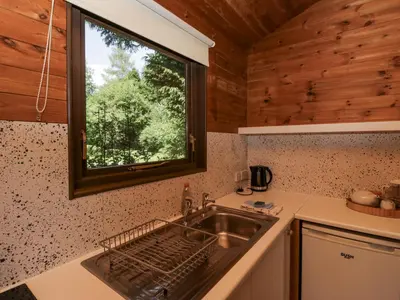 a kitchen with a sink and a window at Grasmere in Ulverston