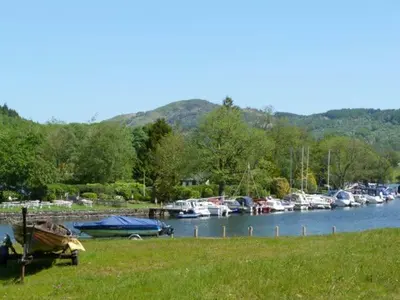 a bunch of boats are docked at a marina at The Byre in Grange Over Sands