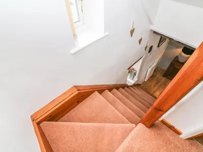an overhead view of a stairwell with a box at Rosemary Cottage in Carnforth