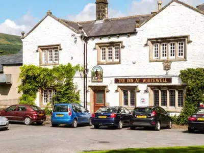 a group of cars parked in front of a building at The Old Forge in Waddington