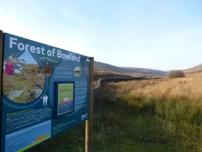 a sign for the forest of bowland in a field at The Old Post Office in Garstang
