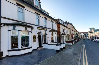 a street with buildings on the side of a road at Adelaide Lodge - Town Centre - Opposite Winter Gardens in Blackpool
