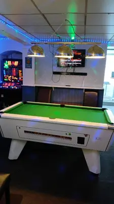 a pool table in a gaming room with at The Merlin Hotel in Blackpool
