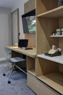 an office with a desk with a laptop and a monitor at Mytton Fold Hotel, Ribble Valley in Langho