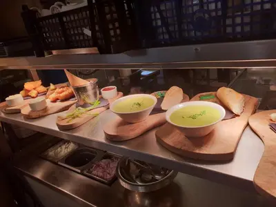a counter with bowls of soup and other food at The Bluebird Inn at Samlesbury in Preston