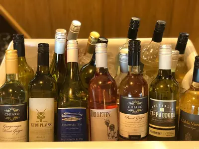 a bunch of wine bottles sitting on a shelf at The Bluebird Inn at Samlesbury in Preston