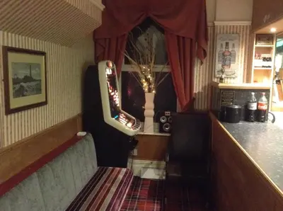 a room with a bar with a counter and a window at Victoria Hotel Blackpool in Blackpool