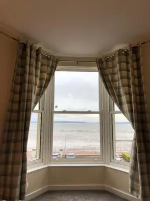 a window with a view of the beach at Morecambe sea view apartment 203 in Morecambe