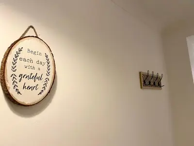 a wooden sign hanging on a wall at Fabrik Apartments - Harrowside by Blackpool Service Apartements in Blackpool