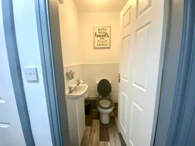 a small bathroom with a toilet and a sink at Fabrik Apartments - Harrowside by Blackpool Service Apartements in Blackpool
