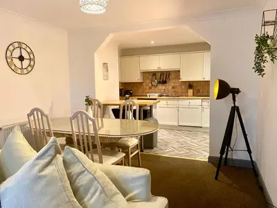 a kitchen and dining room with a table and chairs at Fabrik Apartments - Harrowside by Blackpool Service Apartements in Blackpool