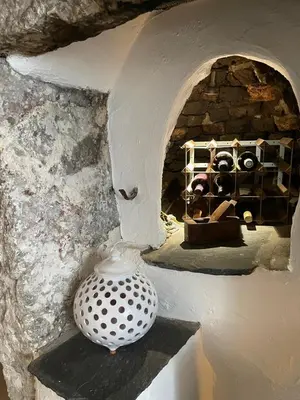a vase sitting on a shelf in a stone oven at Low Fell in Ulverston