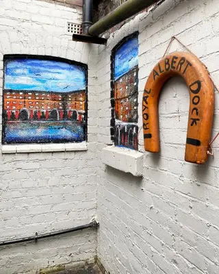 two windows on the side of a building at The Docklands SA by Serviced Living Liverpool in Liverpool
