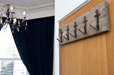 a door with a sign with the wordfaith on it at The Leicester in Southport