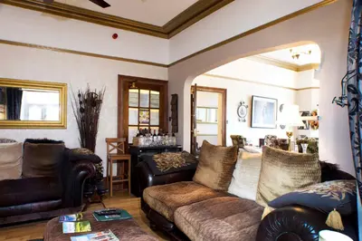 a living room with a couch and a table at The Leicester in Southport