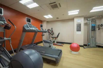 a gym with a treadmill and a exercise bike at Grand Hotel Blackpool in Blackpool