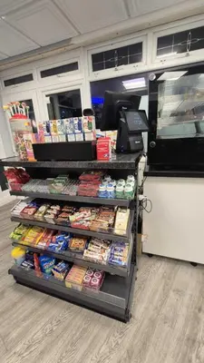 a storeacist with a display of food and a cash register at MARS Hotel Seaview Blackpool in Blackpool