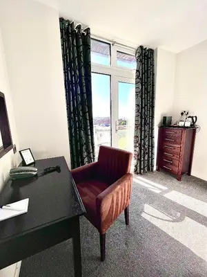 an office with a chair and a desk and a window at Mode Hotel St Annes in Lytham St Annes