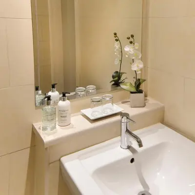 a bathroom with a sink and a mirror at Mode Hotel St Annes in Lytham St Annes