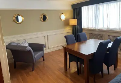 a dining room with a table and chairs at The Liner at Liverpool in Liverpool