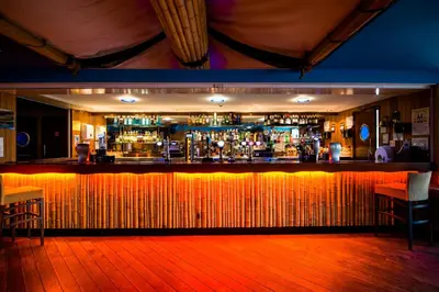 a bar with a wooden floor and a barraged at The Liner at Liverpool in Liverpool