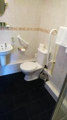 a bathroom with a toilet and a sink at Lancaster Townhouse in Lancaster