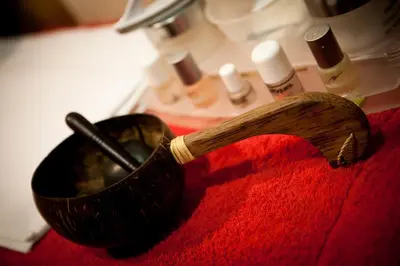 a wooden brush in a pot on a red towel at Lancaster House Hotel in Lancaster
