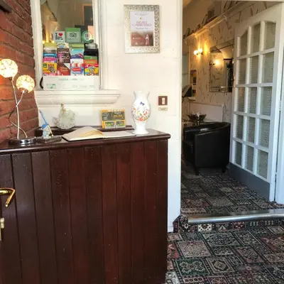 a counter with a vase sitting on top of it at Oban House in Blackpool