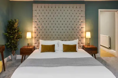 a bedroom with a large white bed and two lamps at Host & Stay - The Georgian Quarters at Falkner Street in Liverpool