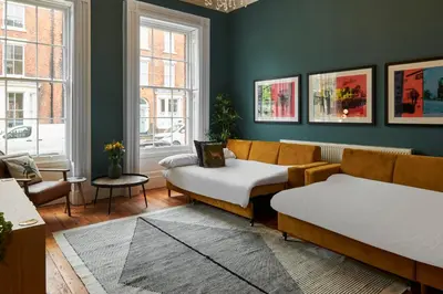 a living room with two beds and a couch at Host & Stay - The Georgian Quarters at Falkner Street in Liverpool