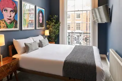 a bedroom with a large white bed and a window at Host & Stay - The Georgian Quarters at Falkner Street in Liverpool