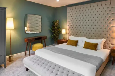 a bedroom with a large bed with a large headboard at Host & Stay - The Georgian Quarters at Falkner Street in Liverpool