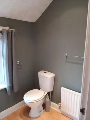 a bathroom with a white toilet in a room at Seaforth Guest House - Pleasure Beach in Blackpool
