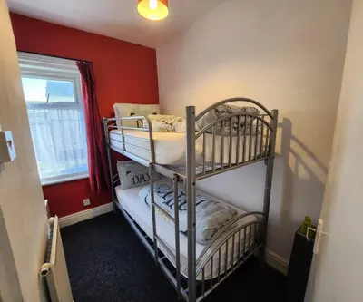 a bedroom with two bunk beds in a room at The Moorfield in Blackpool