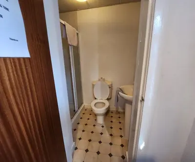 a bathroom with a toilet and a sink at The Moorfield in Blackpool