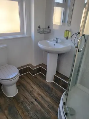 a bathroom with a sink and a toilet at 140 Bond - Holiday Home in Blackpool