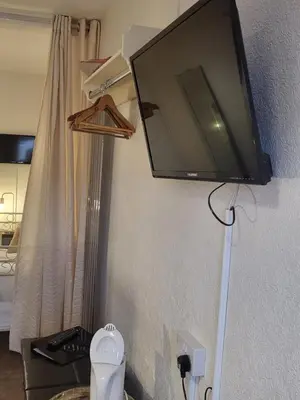 a flat screen tv hanging on a wall at 140 Bond - Holiday Home in Blackpool