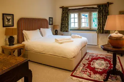 a bedroom with a bed and a window at The Fleece Inn in Shireshead
