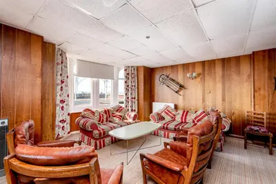 a living room with couches and a table and chairs at The Headlands in Blackpool