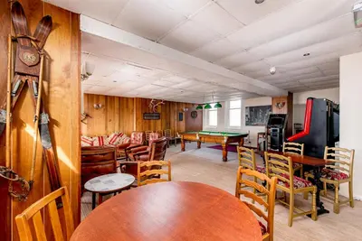 a room with tables and chairs and a pool table at The Headlands in Blackpool
